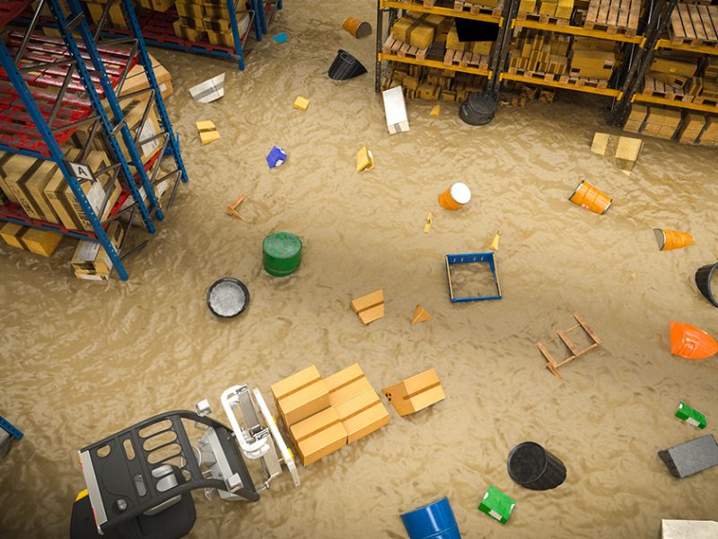Flood Insurance: interior of a warehouse full of goods damaged by a flood of water and mud. 3d render image